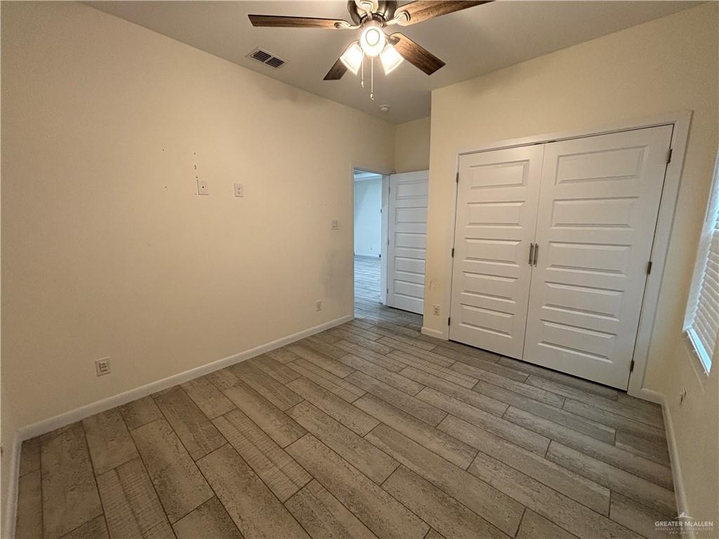 212 Lauryn Drive, Unit 3 San Juan, TX 78589 - Photo 16 of 27 wooden floor in an empty room