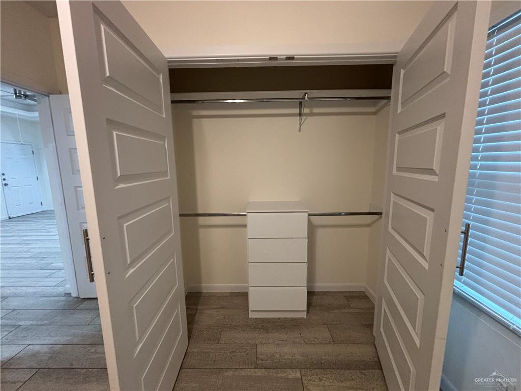 212 Lauryn Drive, Unit 3 San Juan, TX 78589 - Photo 17 of 27 a view of storage and utility room with empty racks