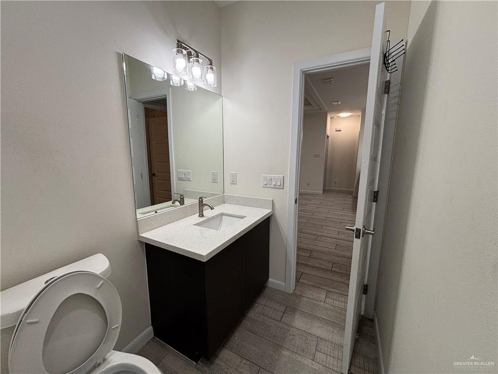 212 Lauryn Drive, Unit 3 San Juan, TX 78589 - Photo 19 of 27 a bathroom with a sink and a mirror