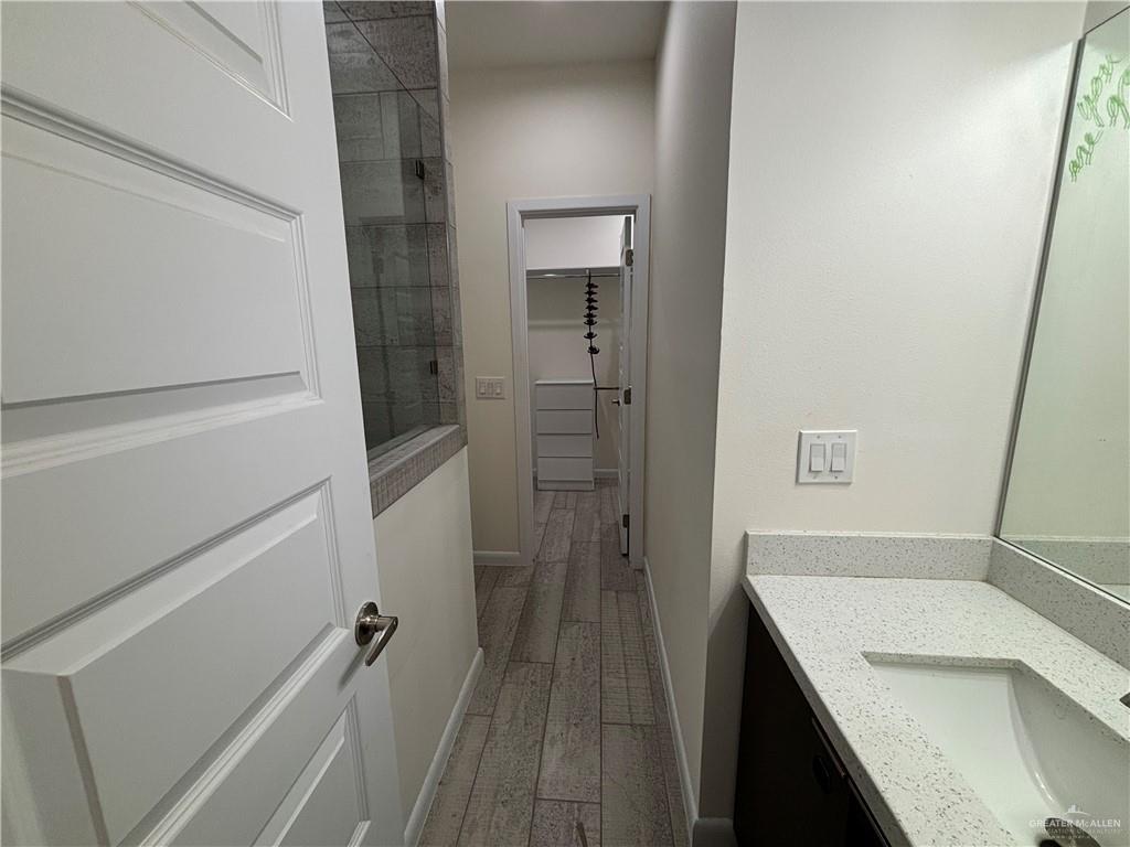 212 Lauryn Drive, Unit 3 San Juan, TX 78589 - Photo 24 of 27 a bathroom with a sink a toilet and shower