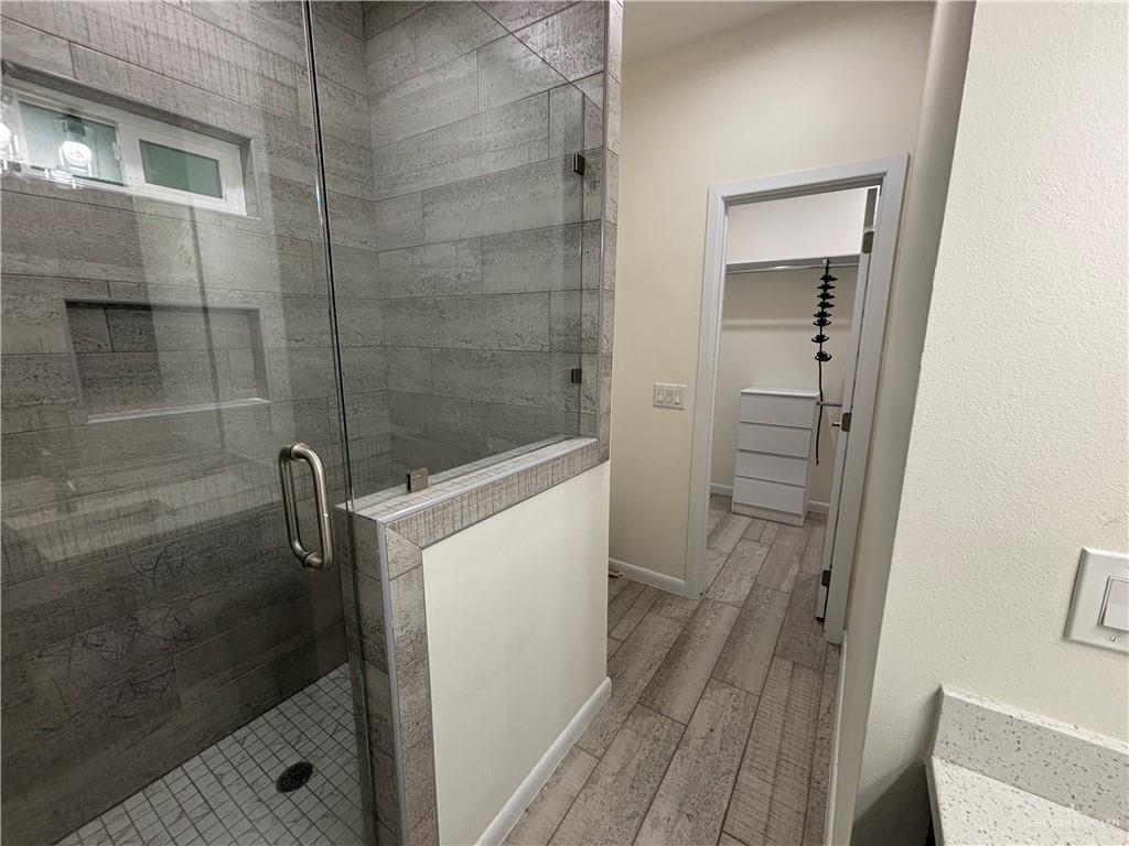 212 Lauryn Drive, Unit 3 San Juan, TX 78589 - Photo 25 of 27 a bathroom with a shower and a sink