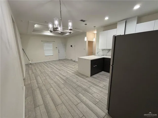 a bathroom with a shower and a sink