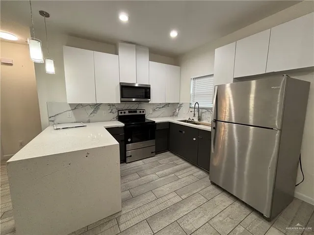 a view of kitchen and front door
