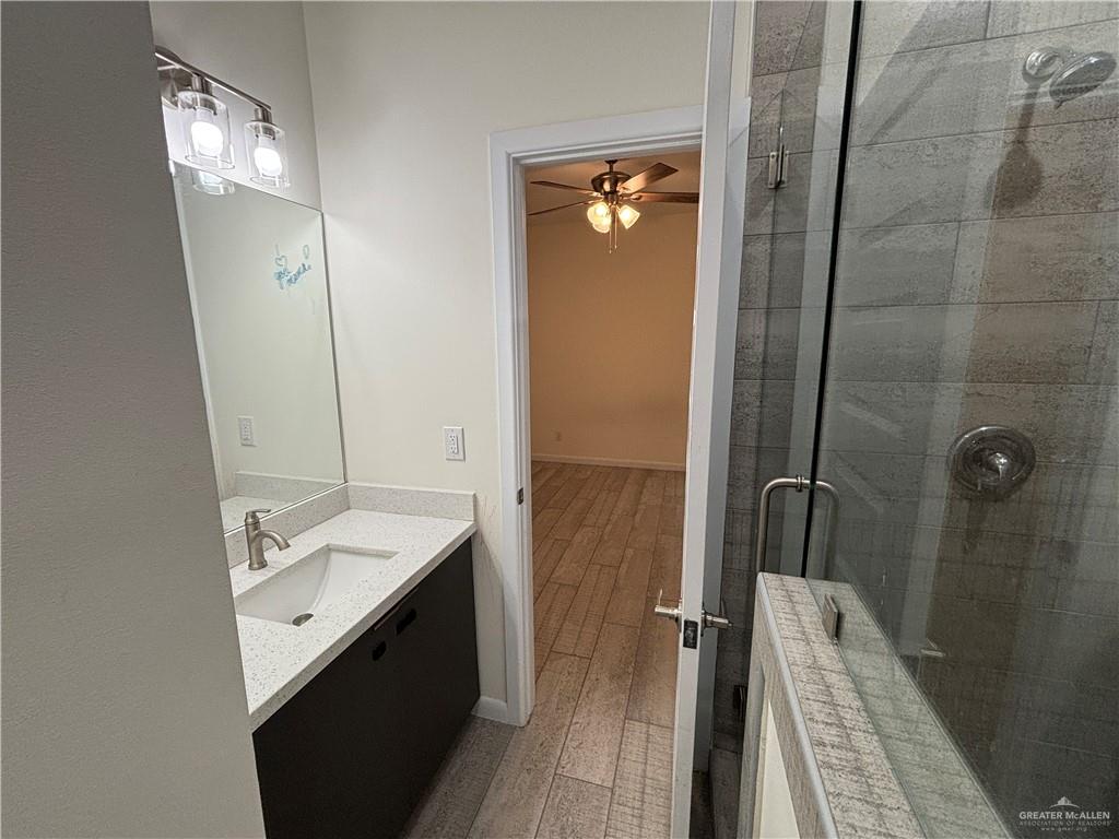 212 Lauryn Drive, Unit 3 San Juan, TX 78589 - Photo 8 of 27 a spacious bathroom with a granite countertop sink a mirror and shower