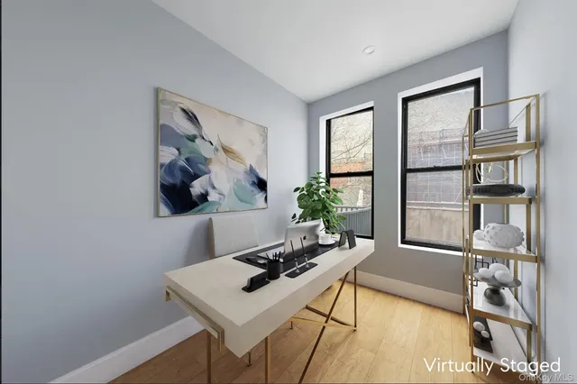 a living room with furniture a rug and white walls