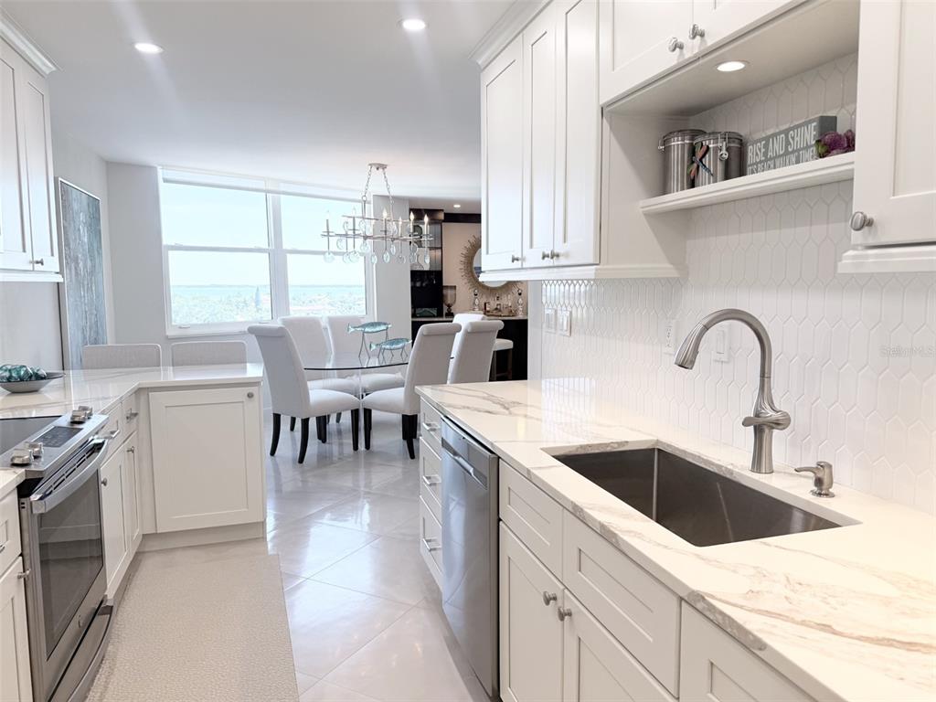1050 Longboat Club Road, Unit 803 Longboat Key, FL 34228 - Photo 18 of 39 a kitchen with a sink cabinets and window