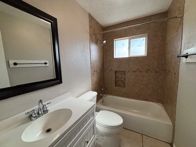 a bathroom with a sink a mirror a toilet and bathtub