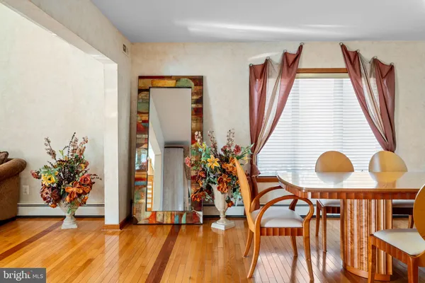 a kitchen with stainless steel appliances kitchen island granite countertop a refrigerator and a sink