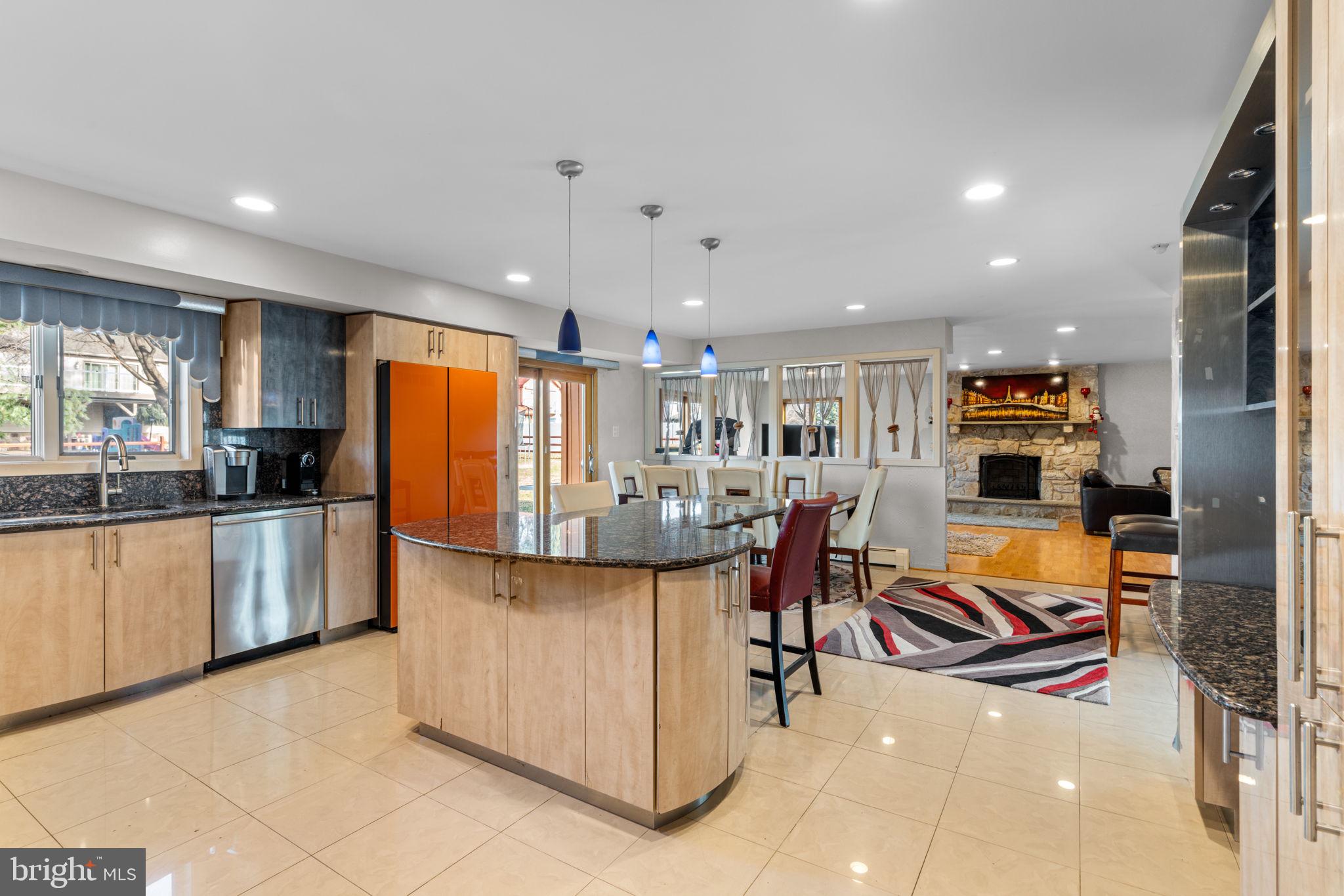 509 Long Lane Huntingdon Valley, PA 19006 - Photo 12 of 46 a kitchen with stainless steel appliances kitchen island granite countertop a refrigerator and a sink