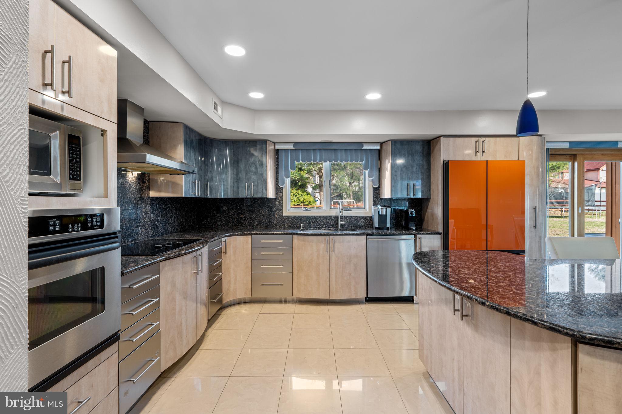 509 Long Lane Huntingdon Valley, PA 19006 - Photo 13 of 46 a kitchen with stainless steel appliances granite countertop a stove a sink and a refrigerator