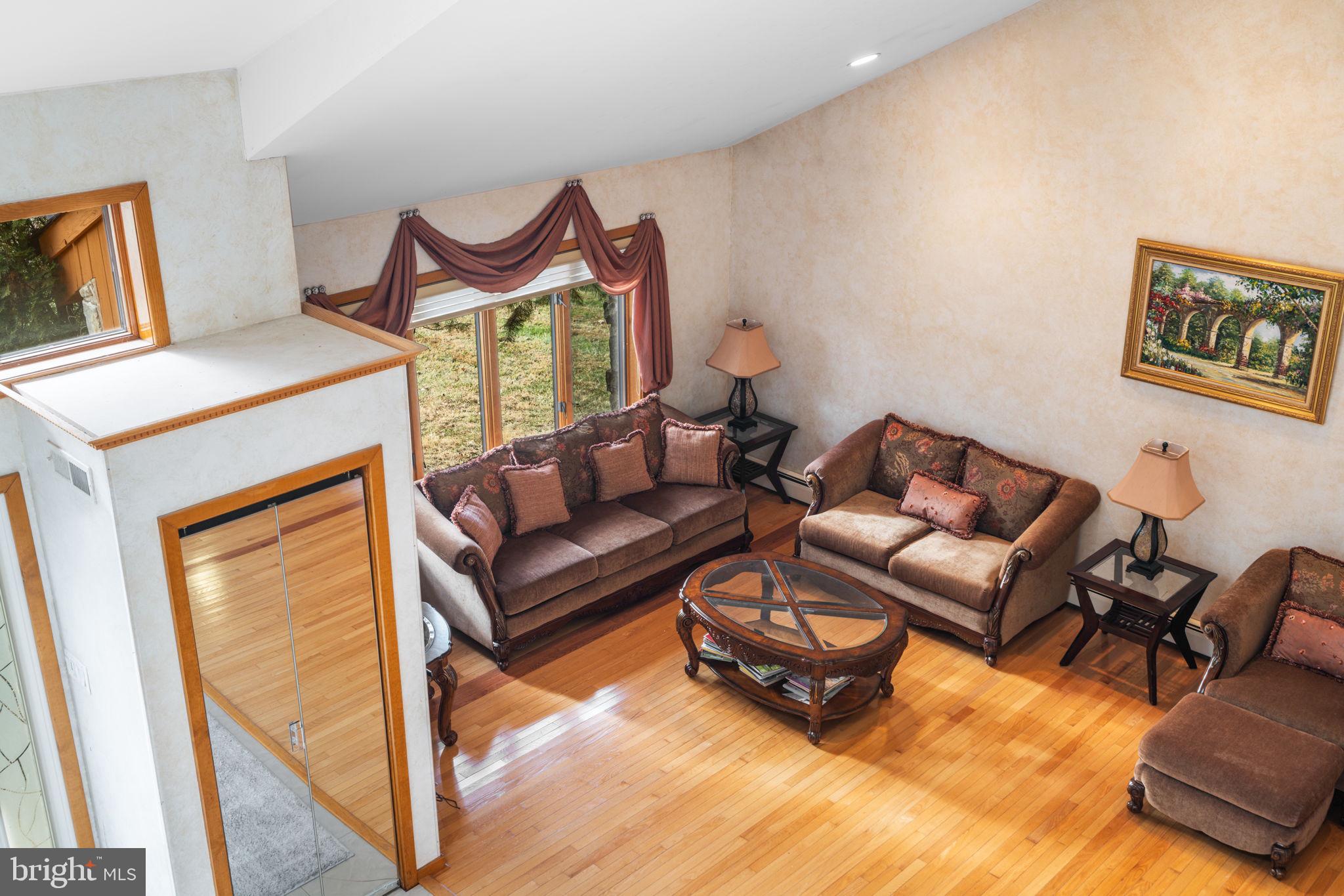 509 Long Lane Huntingdon Valley, PA 19006 - Photo 25 of 46 a living room with furniture and a wooden floor