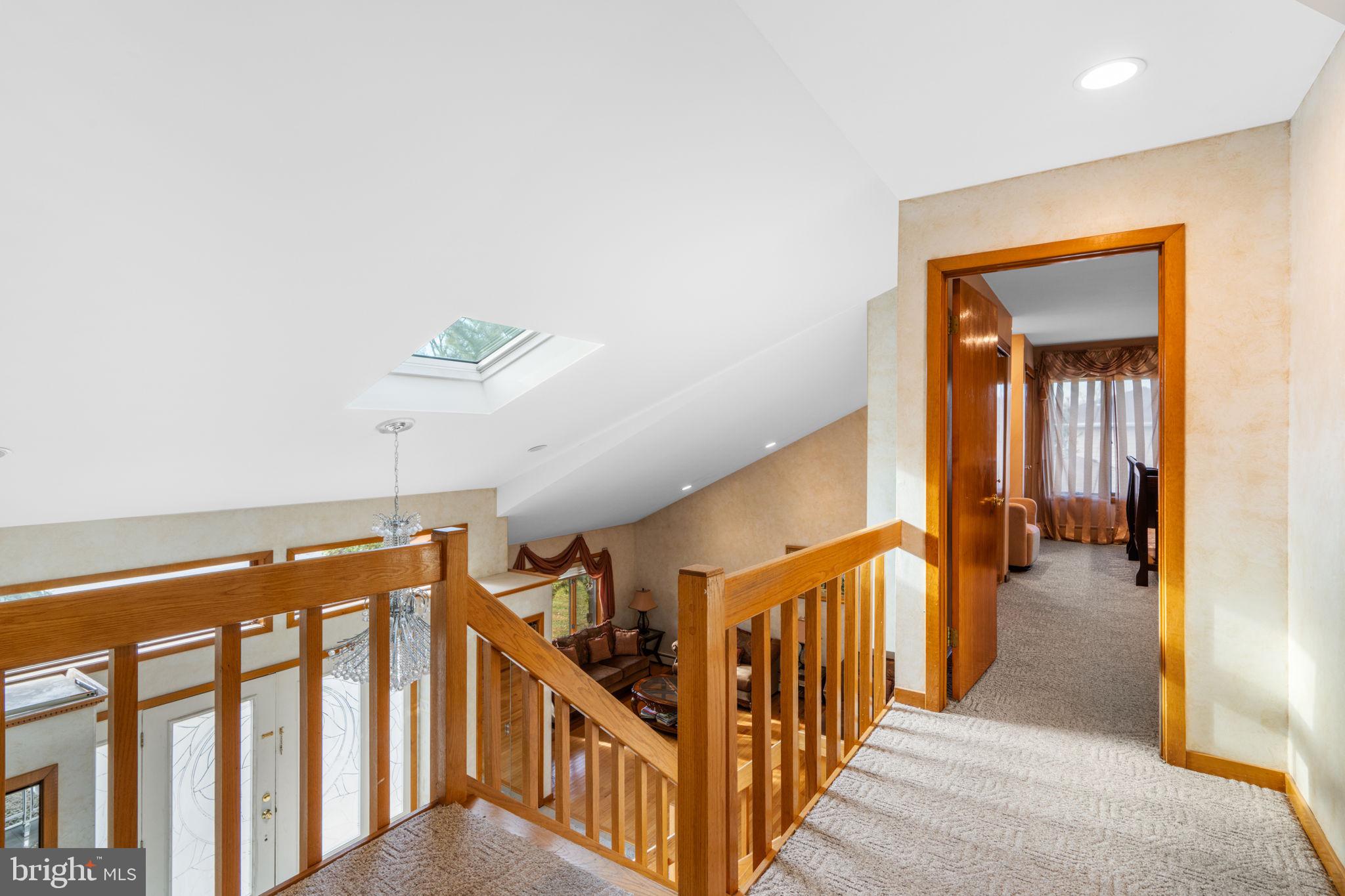 509 Long Lane Huntingdon Valley, PA 19006 - Photo 26 of 46 a view of a hallway with wooden floor and stairs