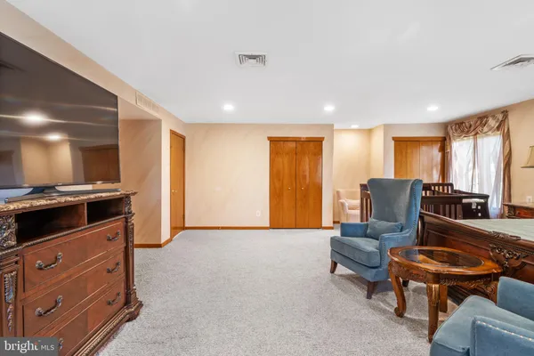 a view of a bedroom from a hallway
