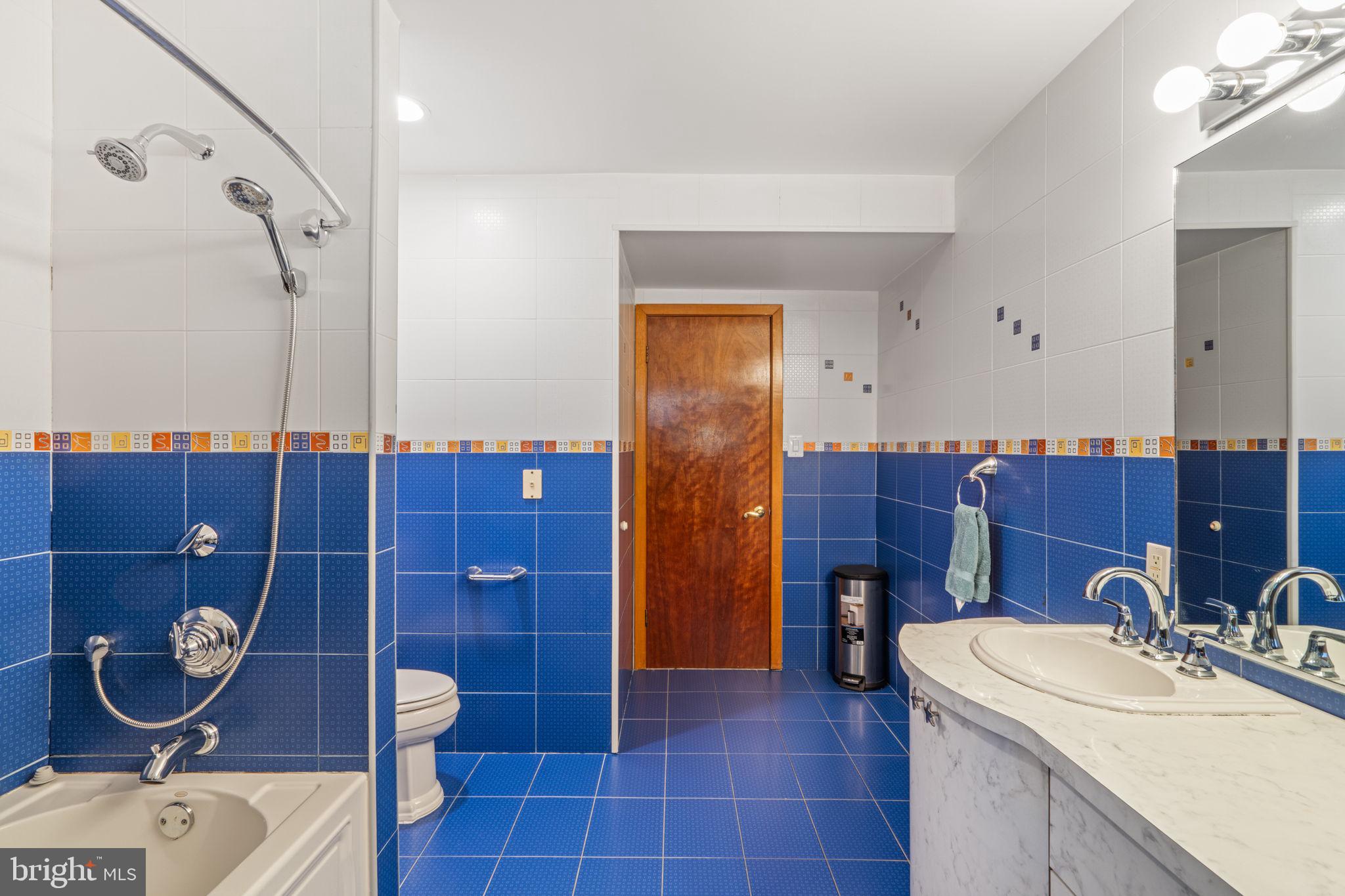 509 Long Lane Huntingdon Valley, PA 19006 - Photo 34 of 46 a bathroom with a sink a toilet and mirror