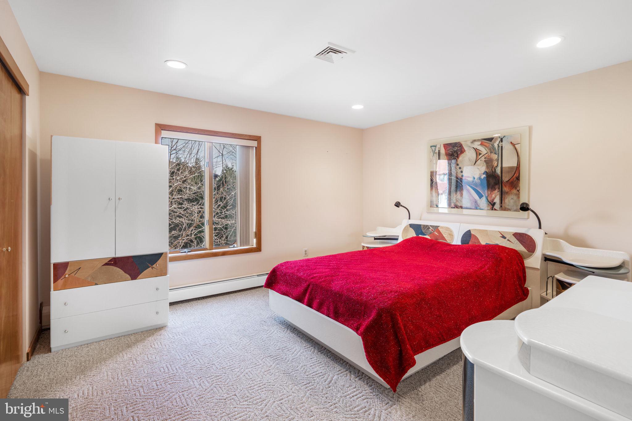 509 Long Lane Huntingdon Valley, PA 19006 - Photo 36 of 46 a bedroom with a bed and a large window