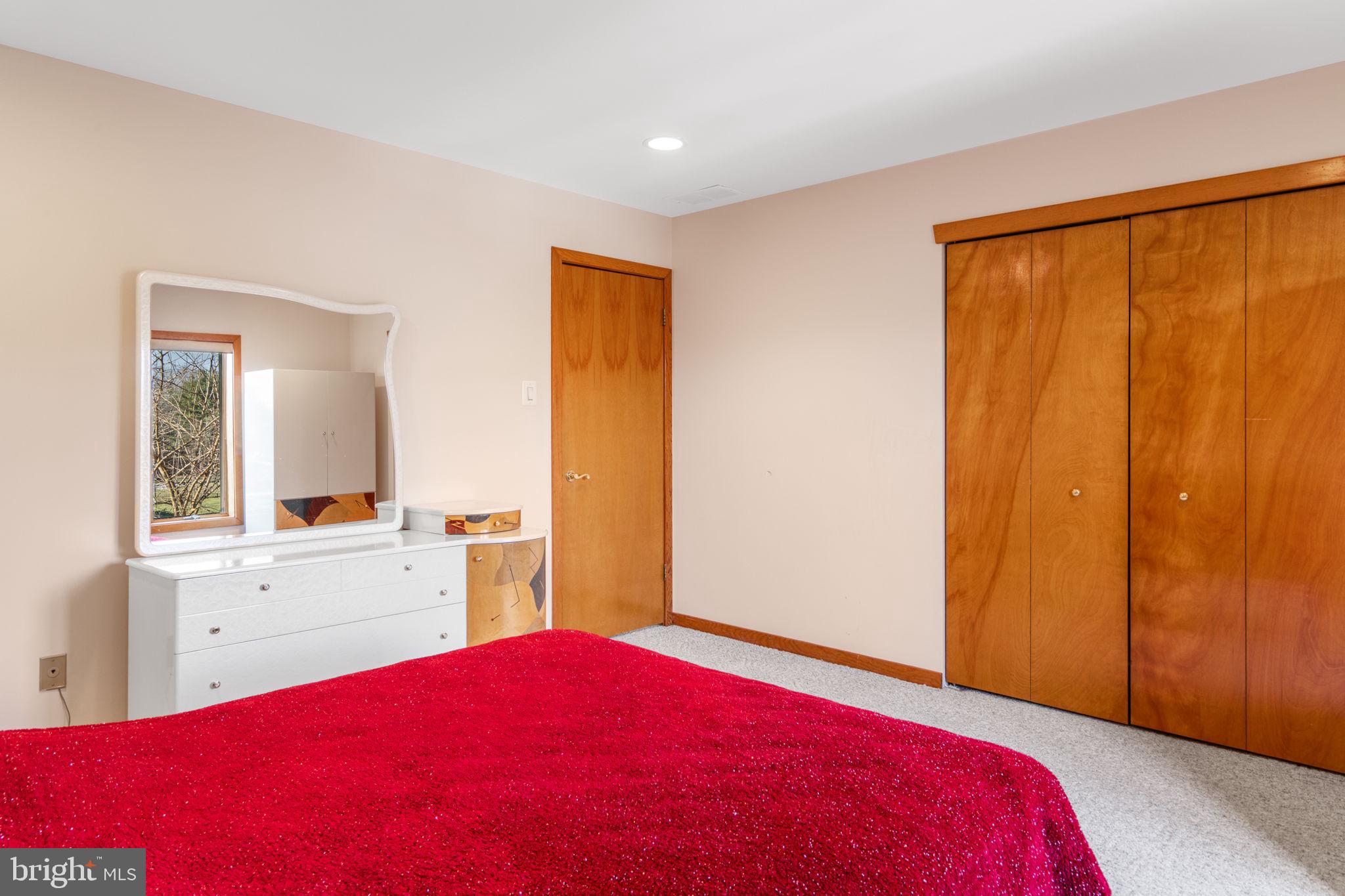 509 Long Lane Huntingdon Valley, PA 19006 - Photo 37 of 46 a bedroom with a bed and a dresser