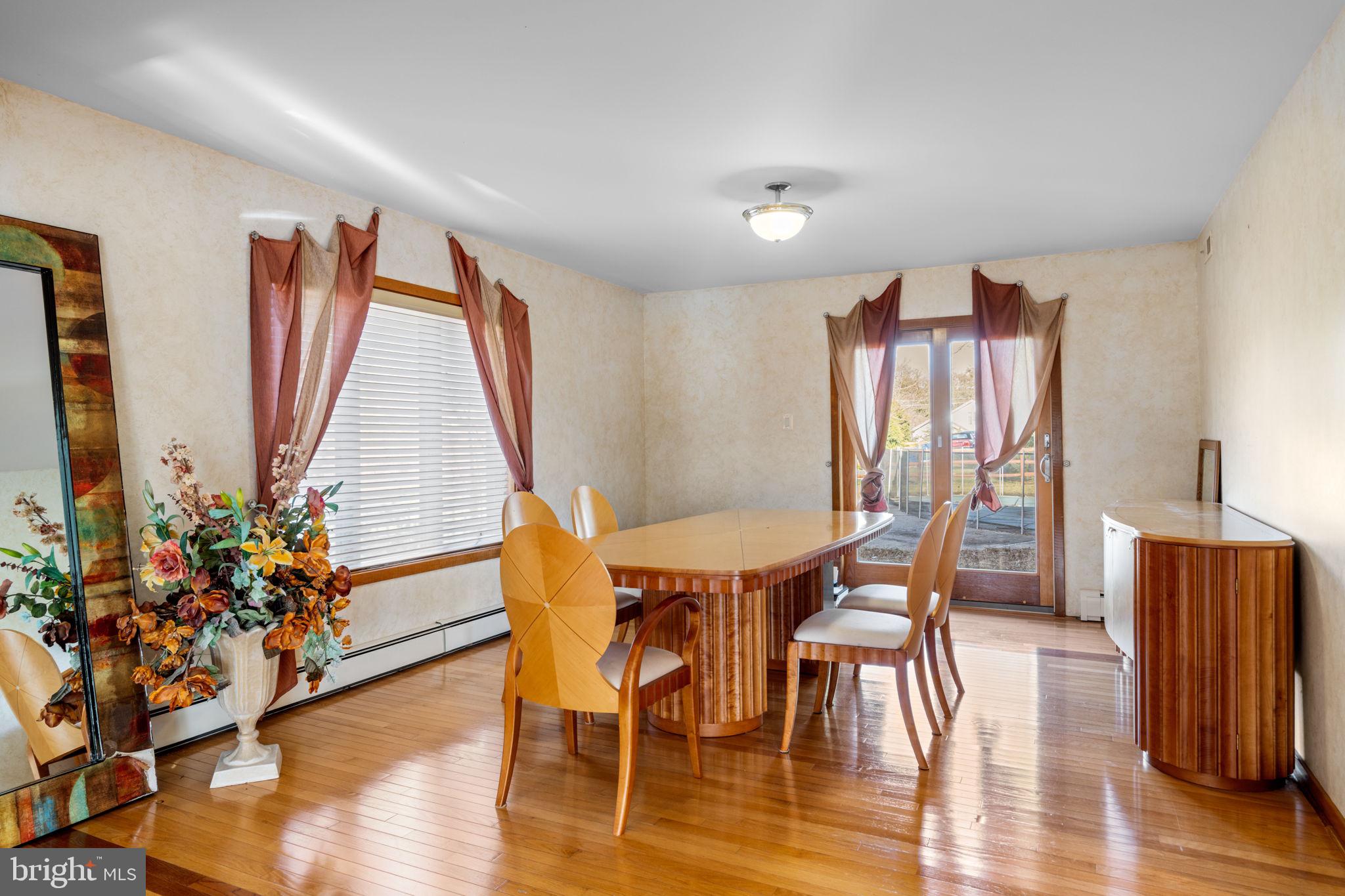 509 Long Lane Huntingdon Valley, PA 19006 - Photo 10 of 46 a view of a dining room with furniture and wooden floor