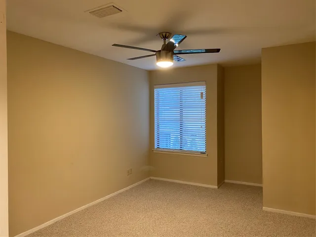 an empty room with a bathroom