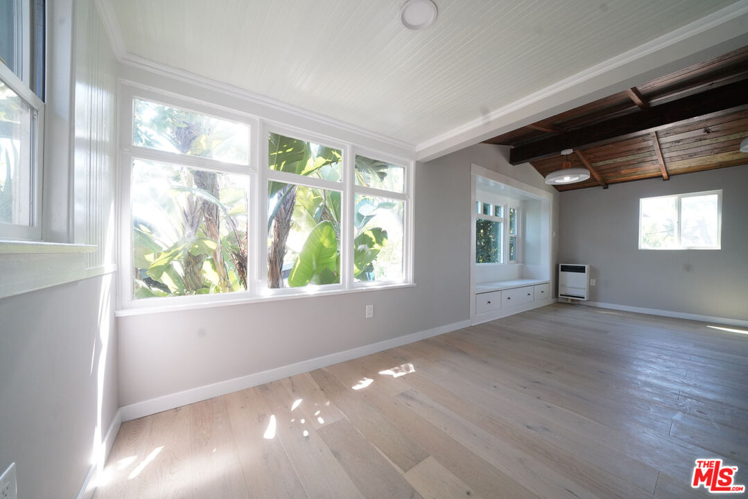 a view of livingroom with window and hardwood floor