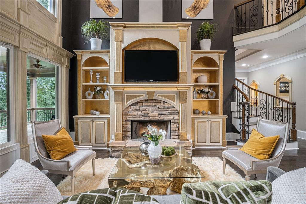 4025 Cascade Road Atlanta, GA 30331 - Photo 14 of 48 a living room with furniture a fireplace and a floor to ceiling window