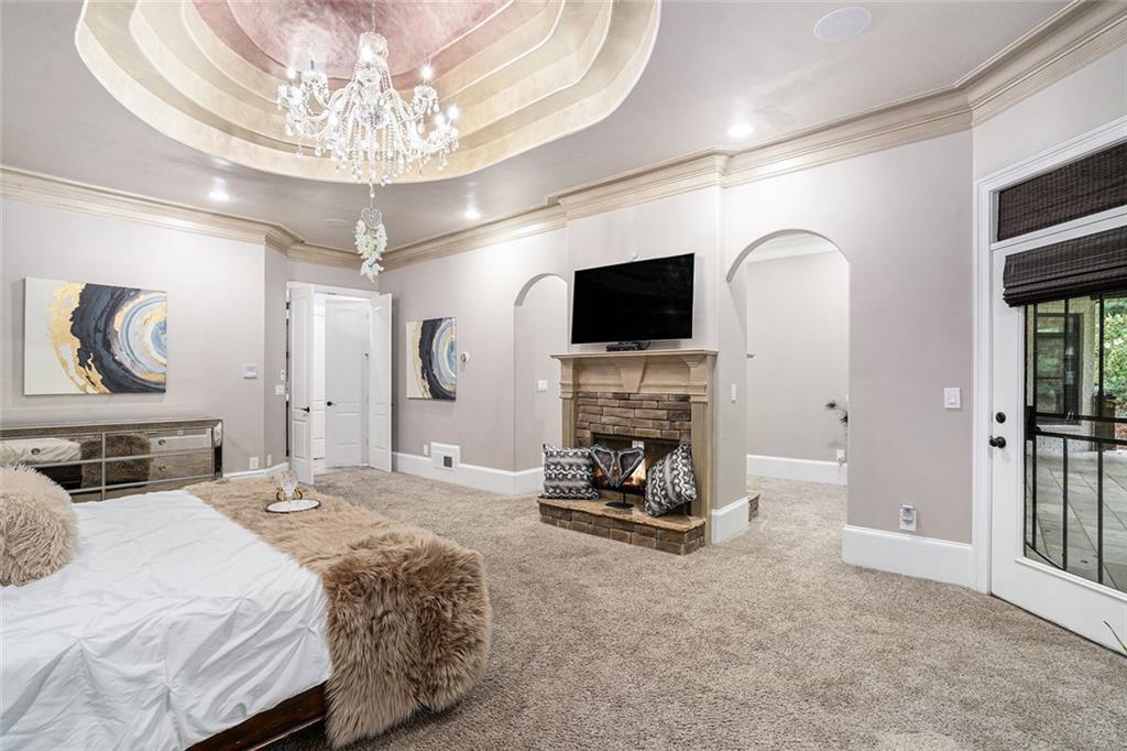4025 Cascade Road Atlanta, GA 30331 - Photo 22 of 48 a bedroom with a bed and a flat screen tv