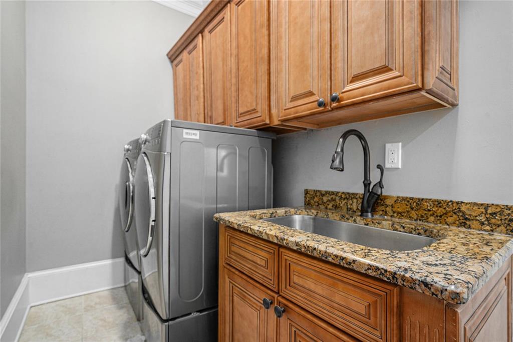 4025 Cascade Road Atlanta, GA 30331 - Photo 28 of 48 a kitchen with stainless steel appliances granite countertop a refrigerator and a sink