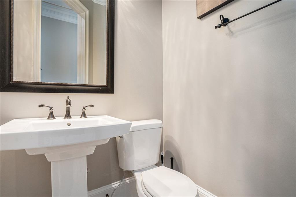 4025 Cascade Road Atlanta, GA 30331 - Photo 29 of 48 a bathroom with a toilet a sink and mirror