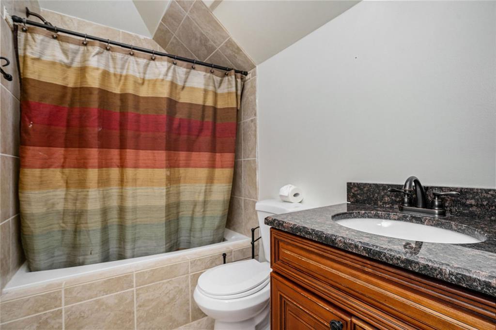 4025 Cascade Road Atlanta, GA 30331 - Photo 30 of 48 a bathroom with a granite countertop sink toilet and shower