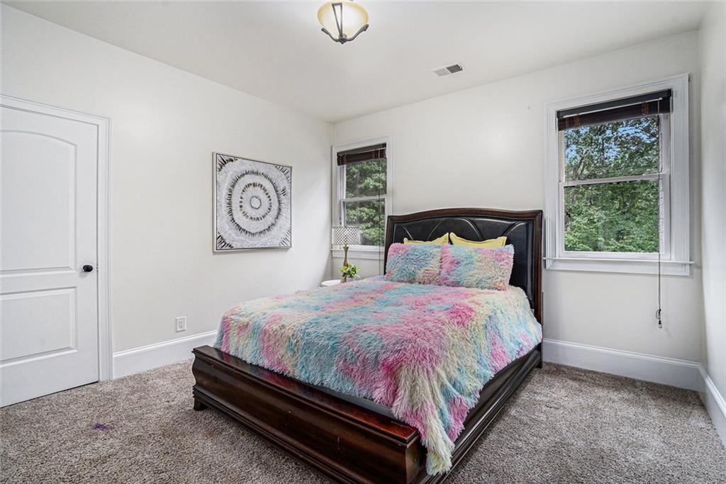 4025 Cascade Road Atlanta, GA 30331 - Photo 31 of 48 a bedroom with a bed and a window
