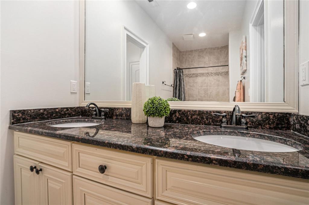 4025 Cascade Road Atlanta, GA 30331 - Photo 32 of 48 a bathroom with a sink and a mirror
