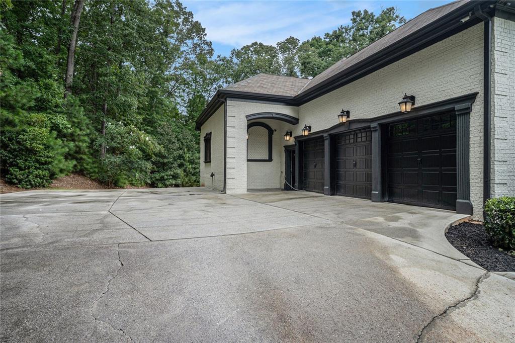 4025 Cascade Road Atlanta, GA 30331 - Photo 39 of 48 a front view of a house with a yard and garage
