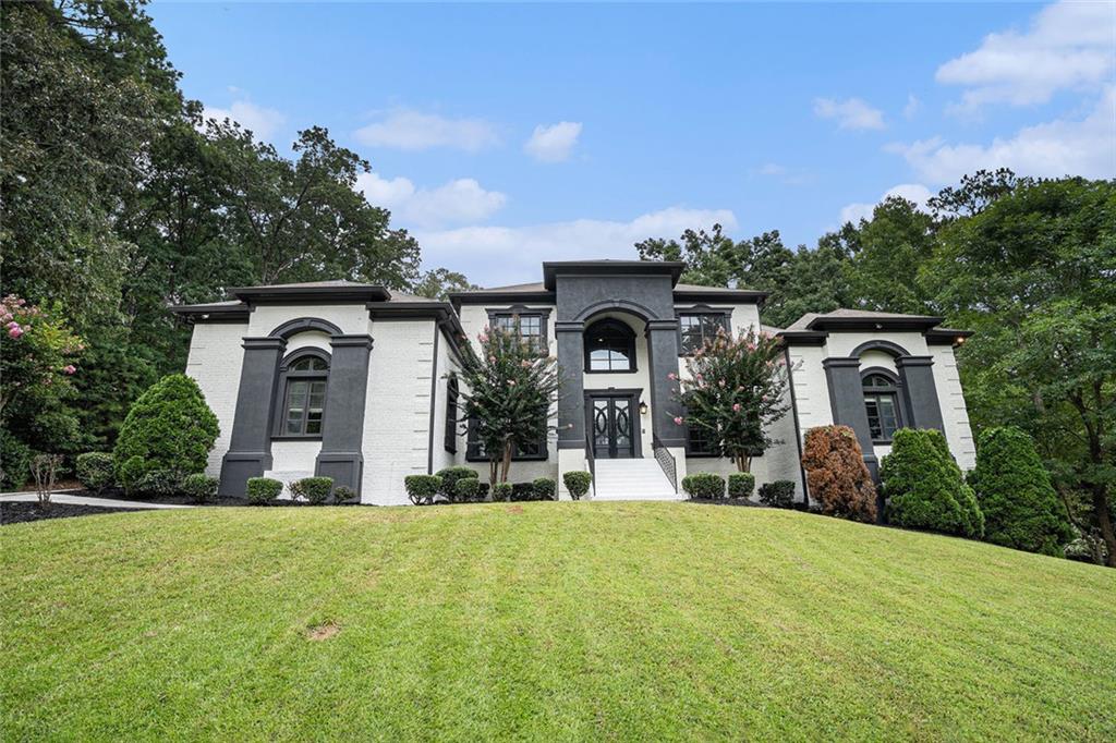 4025 Cascade Road Atlanta, GA 30331 - Photo 9 of 48 a front view of a house with a yard