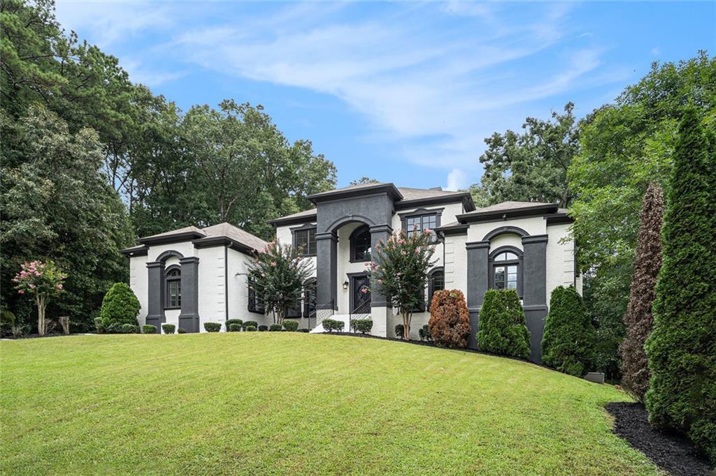 4025 Cascade Road Atlanta, GA 30331 - Photo 10 of 48 a front view of a house with yard and green space