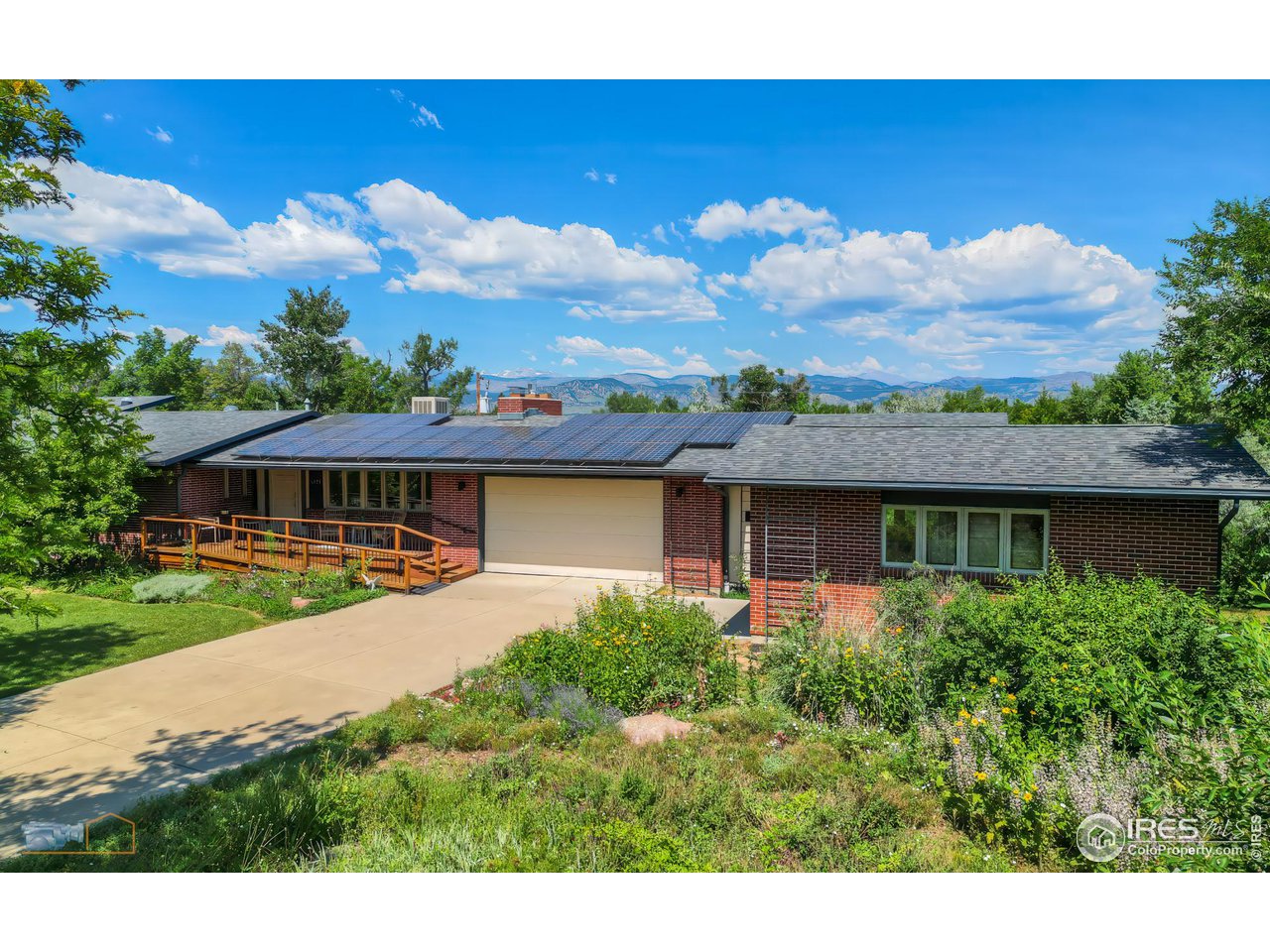 6423 Clearview Road Boulder, CO 80303 - Photo 1 of 40 a view of a house with a yard and potted plants