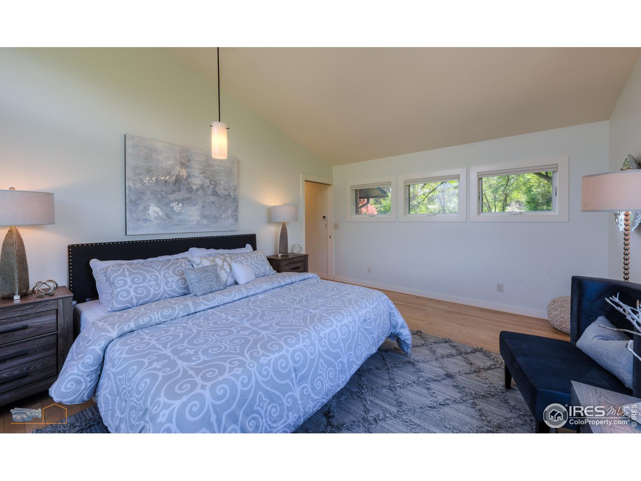 6423 Clearview Road Boulder, CO 80303 - Photo 13 of 40 a bedroom with a bed window and couch