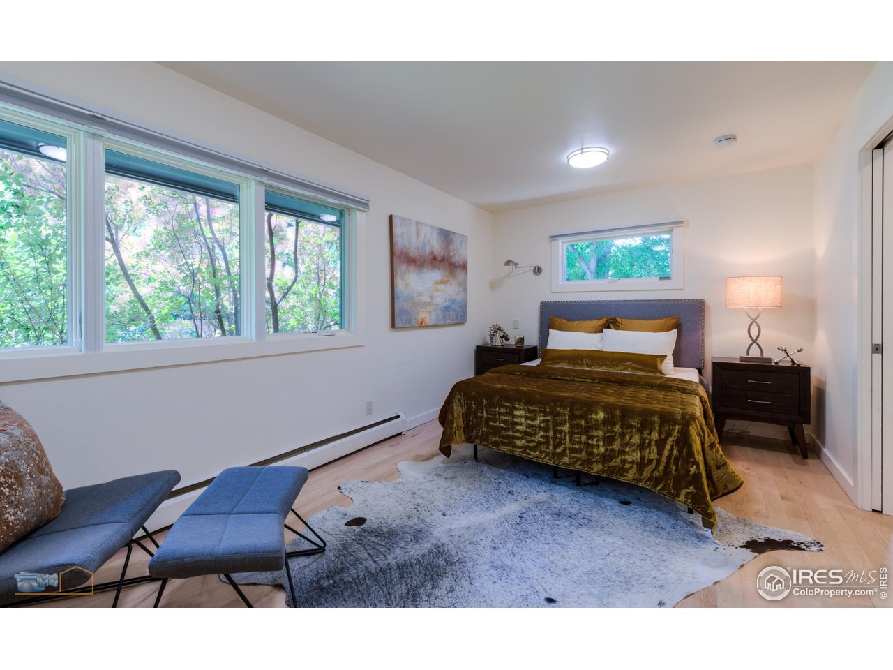 6423 Clearview Road Boulder, CO 80303 - Photo 17 of 40 a bedroom with a bed window and couch