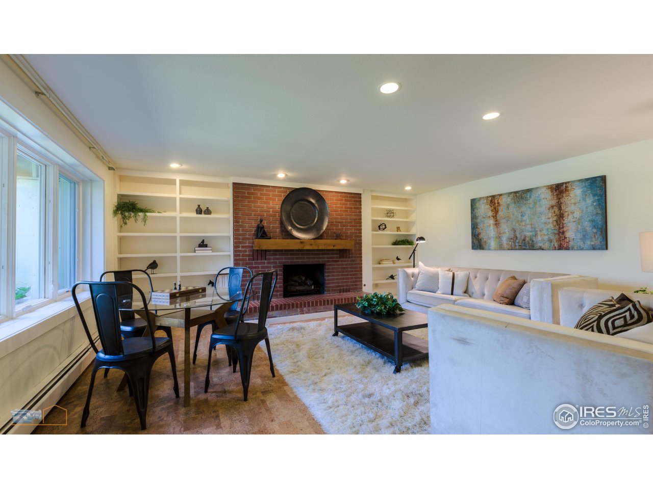 6423 Clearview Road Boulder, CO 80303 - Photo 22 of 40 a living room with furniture a clock and a window