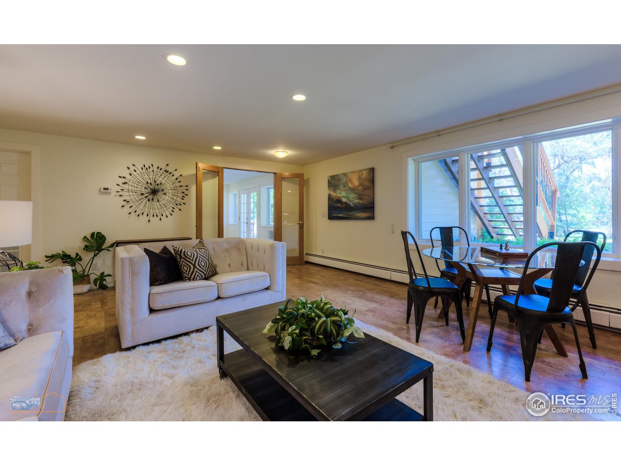 6423 Clearview Road Boulder, CO 80303 - Photo 23 of 40 a living room with furniture potted plant and a large window