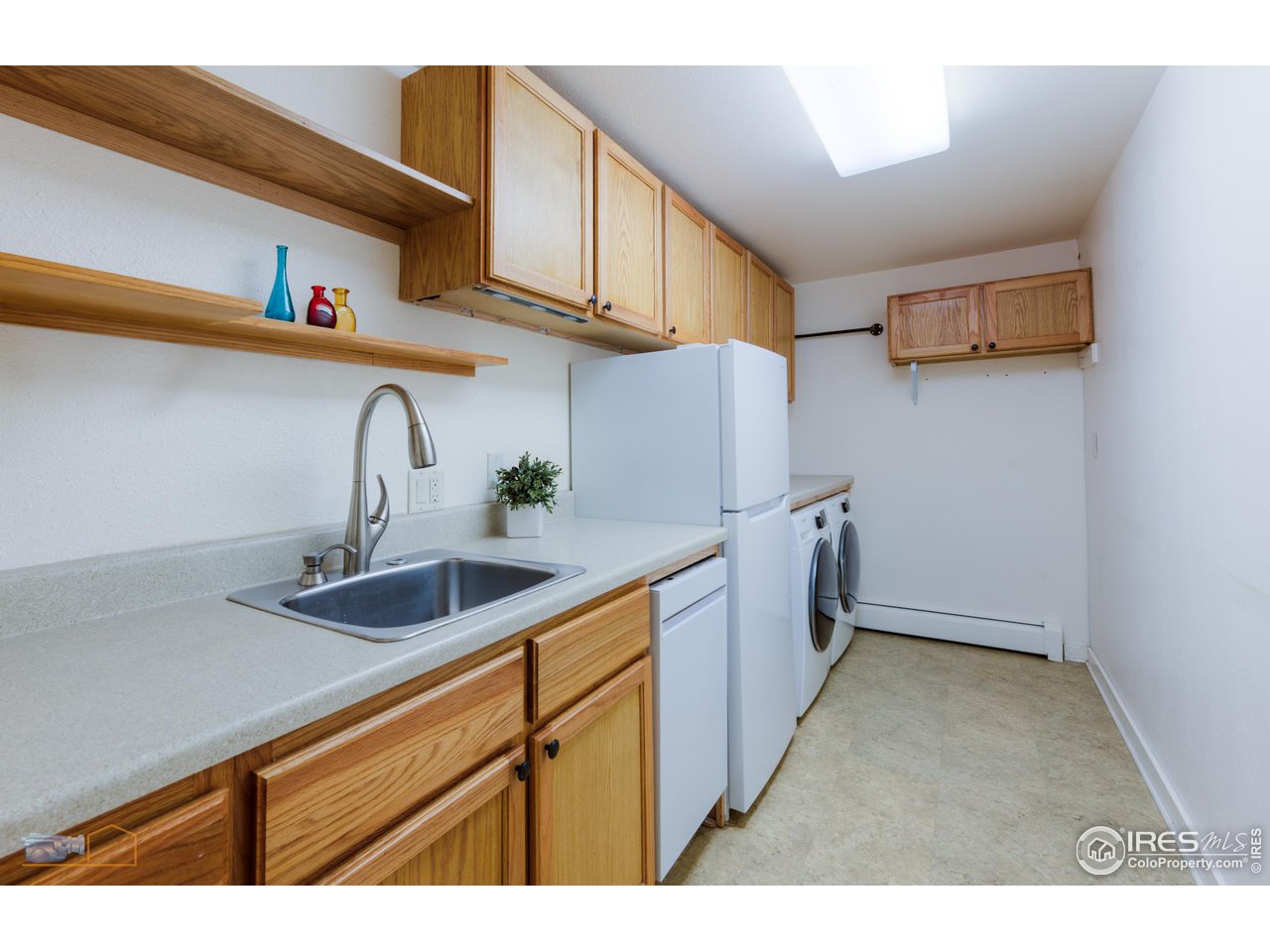 6423 Clearview Road Boulder, CO 80303 - Photo 25 of 40 a kitchen with stainless steel appliances granite countertop a sink and cabinets