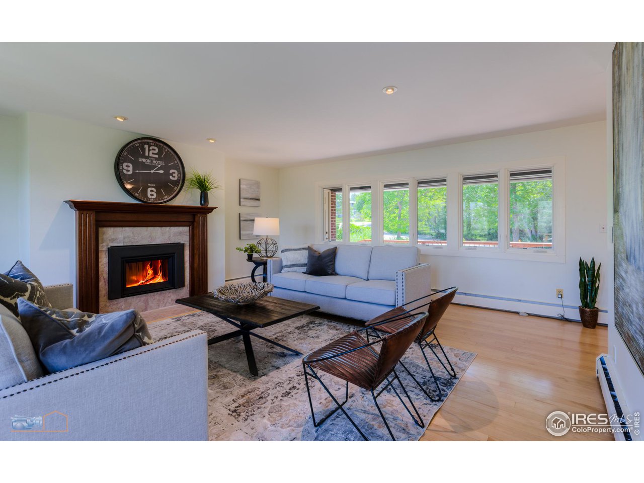 6423 Clearview Road Boulder, CO 80303 - Photo 5 of 40 a living room with furniture a fireplace and a large window