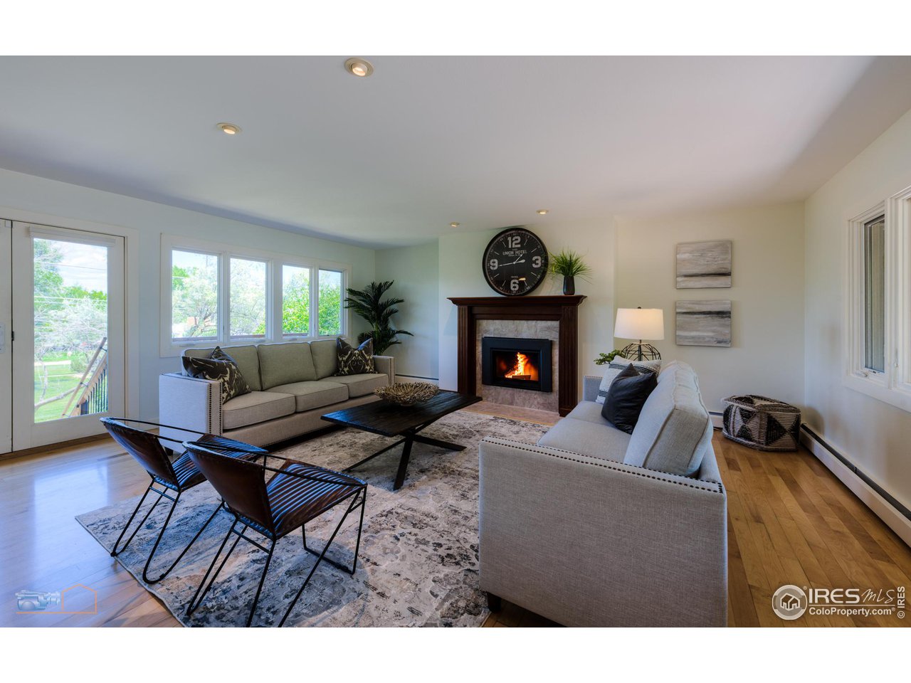 6423 Clearview Road Boulder, CO 80303 - Photo 6 of 40 a living room with furniture a fireplace and a table