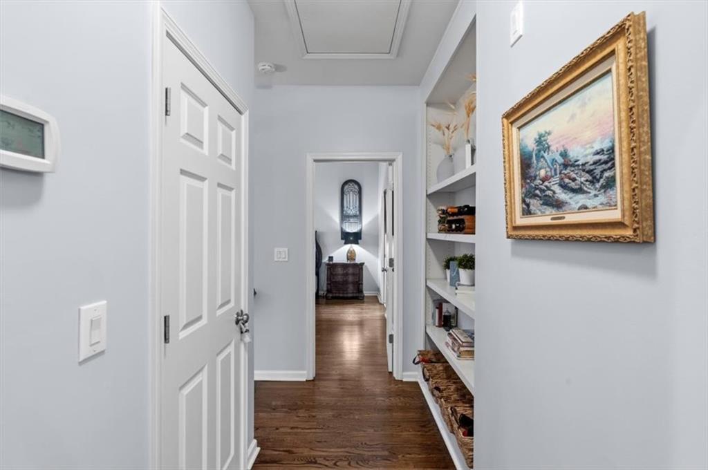 201 Providence Lane Canton, GA 30114 - Photo 19 of 50 a hallway with a furniture and a book shelf