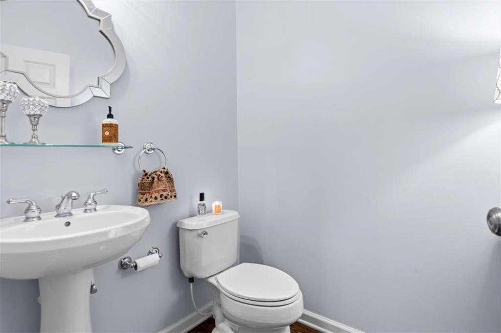 201 Providence Lane Canton, GA 30114 - Photo 20 of 50 a bathroom with a sink a toilet and mirror