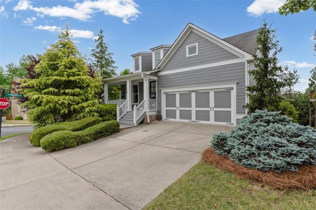 201 Providence Lane Canton, GA 30114 - Photo 2 of 50 a front view of a house with a yard and potted plants