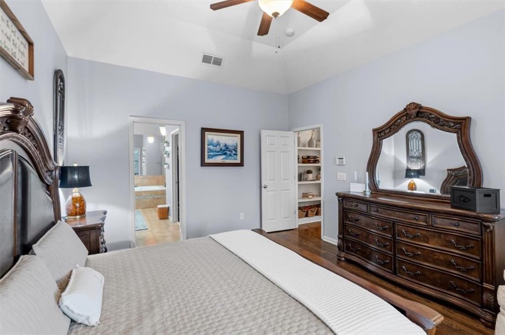 201 Providence Lane Canton, GA 30114 - Photo 22 of 50 a bedroom with bed and wooden floor