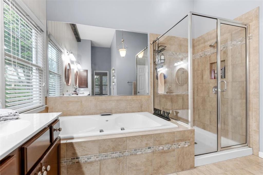 201 Providence Lane Canton, GA 30114 - Photo 24 of 50 a bathroom with a granite countertop tub shower and sink
