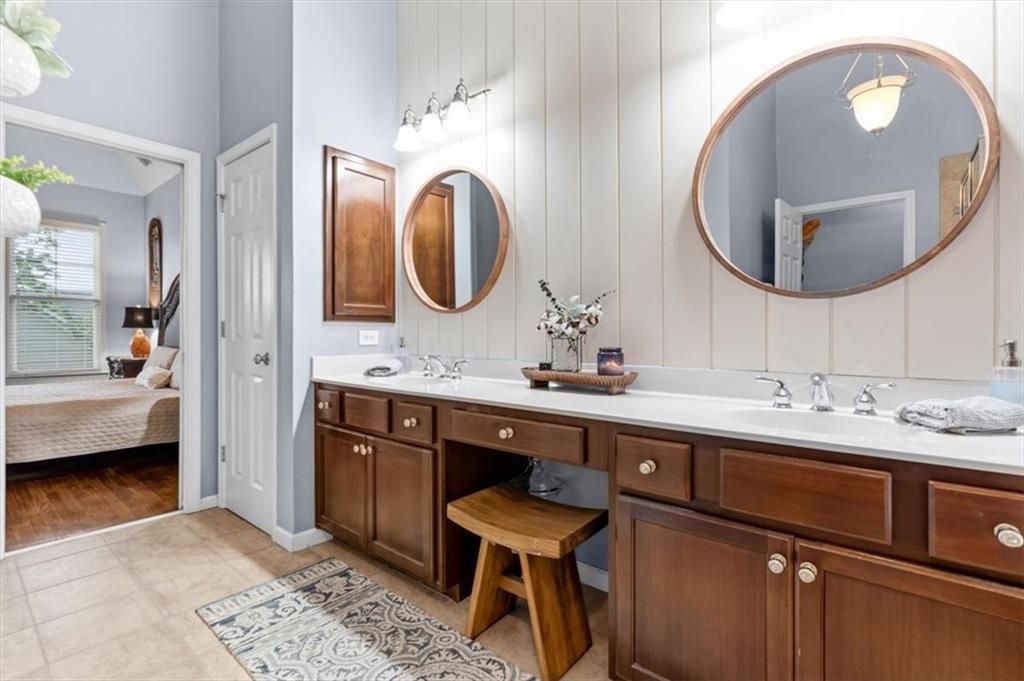 201 Providence Lane Canton, GA 30114 - Photo 25 of 50 a en suite bathroom with a double vanity sink and a mirror