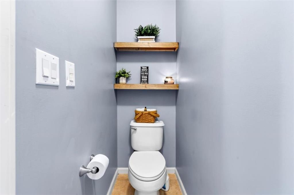 201 Providence Lane Canton, GA 30114 - Photo 26 of 50 a bathroom with a toilet a sink and wooden floor