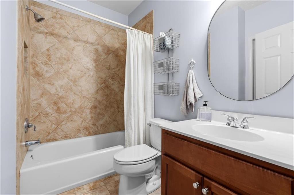201 Providence Lane Canton, GA 30114 - Photo 31 of 50 a bathroom with a sink a toilet and shower