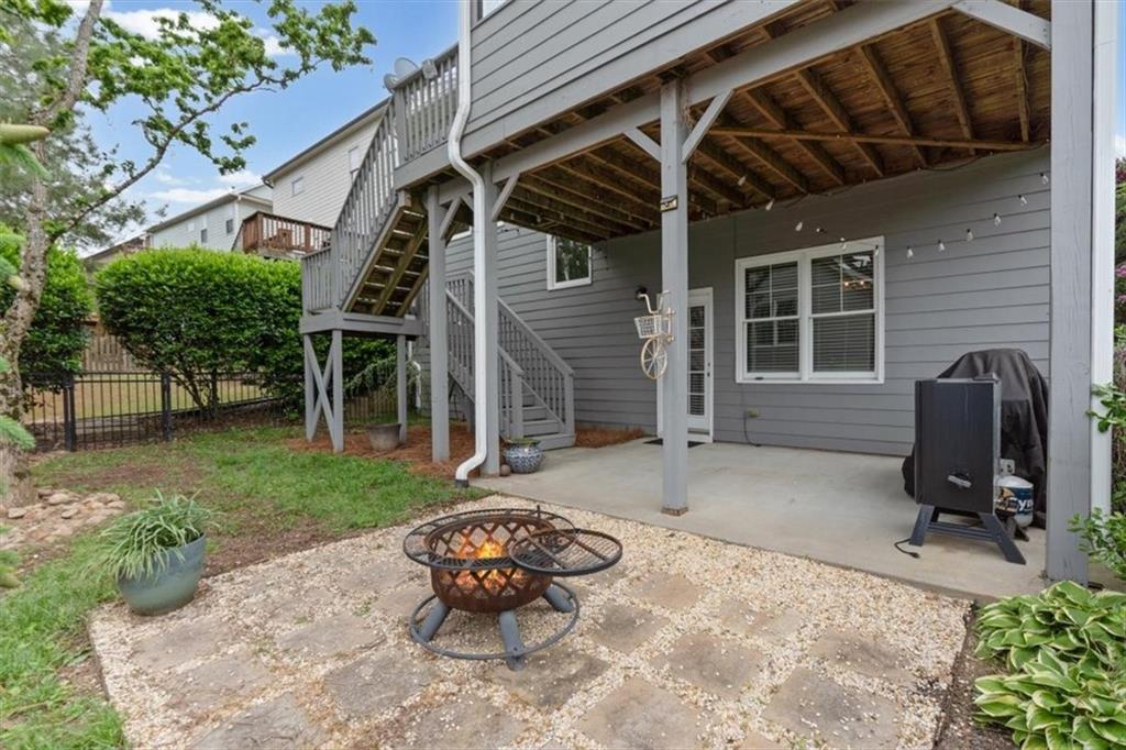 201 Providence Lane Canton, GA 30114 - Photo 33 of 50 a view of a chair and table in backyard of the house
